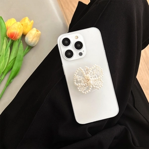 White frosted iPhone case featuring a stylish pearl butterfly folding phone grip with tulips