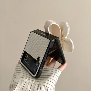 Detail of cream woven leather phone case with large bow wristband for Samsung Z Flip