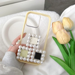 Detail of square pearl ornaments on a translucent yellow protective phone case