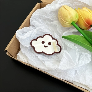 Detail view of a cute cloud-shaped mirror phone stand placed in a decorative gift box.