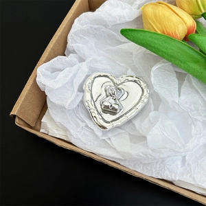 High-quality silver heart-shaped mobile phone grip featuring a cute bear relief