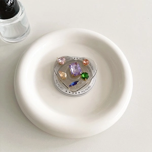Detailed macro view of heart-shaped phone grip with colorful gems and Gift For You text