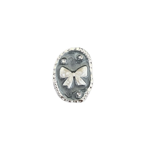 Bow and pearl phone grip with rhinestones on a silver hammered marble base