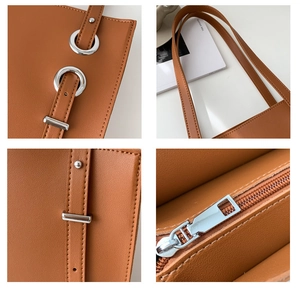 Detail view of brown PU leather tote with silver metal eyelets and fine stitching