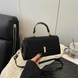 Chic black matte leather rectangular crossbody bag with elegant gold hardware lock