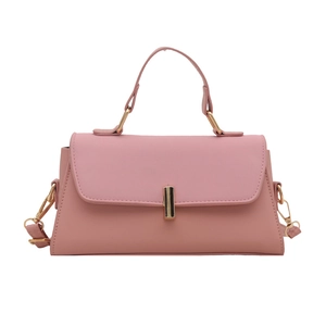 Elegant pink trapezoid handbag with gold twist lock and adjustable shoulder strap