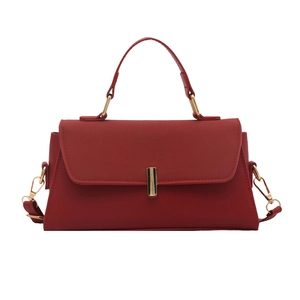 Minimalist red leather handbag with top handle and golden buckle for women