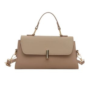 Minimalist light brown crossbody handbag with top handle and gold rectangular metal clasp