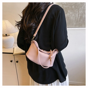 Pink lychee grain leather crossbody hobo bag with adjustable strap and gold hardware