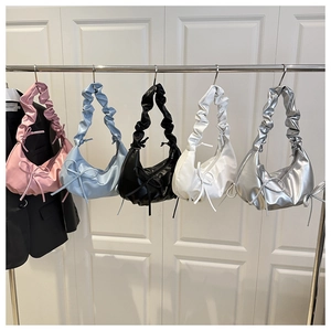 Five colors of ruched bow shoulder bags displayed on hangers for modern fashion trends