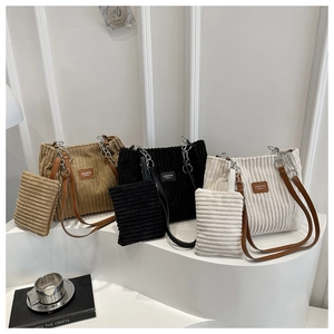 Three colors of corduroy tote bags with matching zipper pouches and silver chain straps