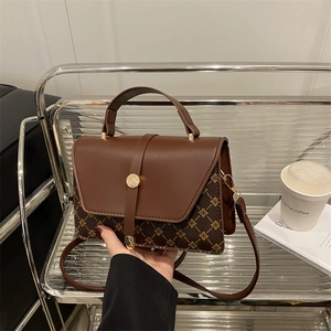 Brown vintage leather crossbody bag with diamond lattice pattern and gold clasp
