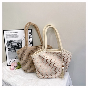 Detail of hand-woven cotton rope bucket bags with textured patterns in a lifestyle setting