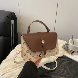 Chic two-tone geometric floral crossbody bag with brown flap and golden hardware accents