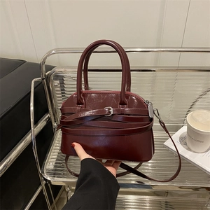 Glossy burgundy retro arched handbag with top handles and adjustable strap for women
