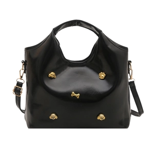 Black fashion bucket bag with gold charms shown on a white background in front view