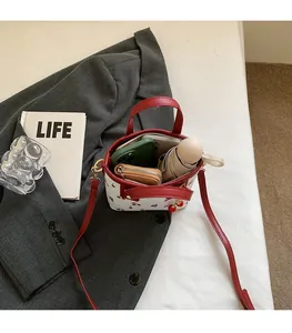 Top view of cherry print bucket bag showing spacious interior with phone and umbrella