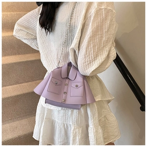 Detail of lavender jacket-style crossbody bag with silver buttons and chain strap