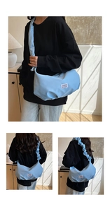 Detailed view of light blue nylon hobo bag with pleated strap and Fashion label