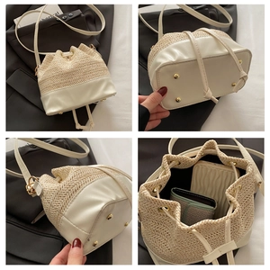 Detailed views of woven straw bucket bag with leather base, metal feet, and interior space