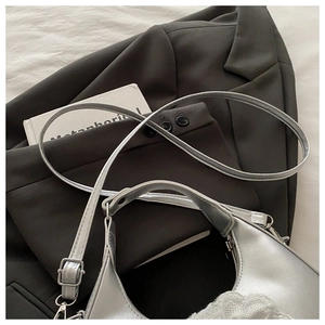 Silver dumpling bag detail with white lace floral trim and detachable shoulder strap