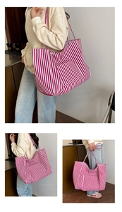 Detail of red and white striped canvas tote bag showing large capacity and side pocket