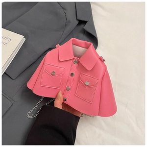 Detail of creative shirt-shaped pink crossbody bag with metal buttons and chain strap