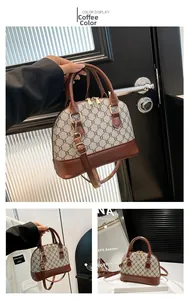 Detail of retro shell bag featuring classic monogram pattern and coffee leather handles