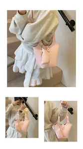 Pink bucket bag with lychee grain texture and matching pouch shown in lifestyle views