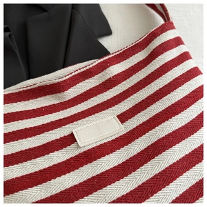 Detailed macro view of the red and white chevron canvas texture with a rectangle patch