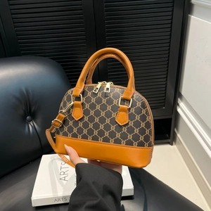 Vintage monogram shell bag in brown and orange leather with top handles and strap