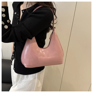 Detailed view of pink glossy PU leather hobo shoulder bag with zipper closure
