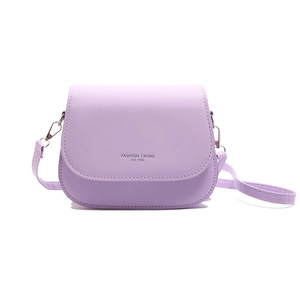 Lavender purple saddle crossbody bag with Fashion Trend 1996 text on white background