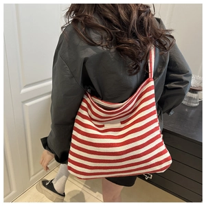 Detailed texture of red and white striped canvas tote bag with thick woven fabric