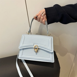 Light blue faux leather crossbody square bag with elegant gold ring metal buckle and handle