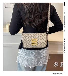 Detail showing the retro patterned shoulder bag worn on the back to show size and draping