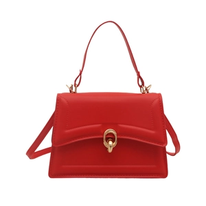 Chic red faux leather tote bag with gold oval lock buckle and versatile shoulder strap