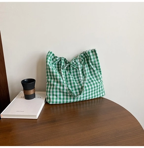 Detail of green and white gingham tote bag with a sweet decorative bow knot