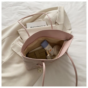 Interior view of spacious pink tote bag showing large storage capacity and soft lining