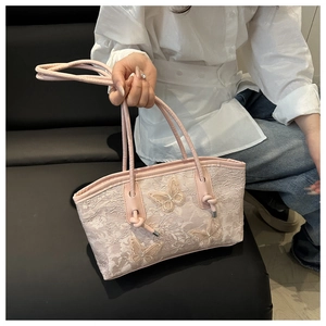 Pink lace tote bag with 3D butterfly floral appliqués and braided rope handle detail