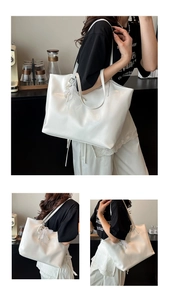 Detail of white glossy tote bag with delicate lace and pearl pendant on a shoulder strap