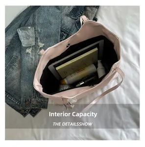 Top view of large pink tote bag interior showing spacious capacity for iPad and books