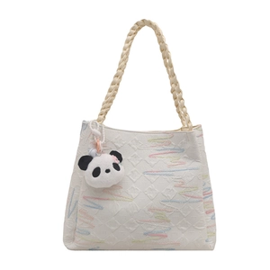 White embroidered tote bag with colorful waves and cute panda charm in front view