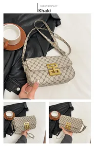 Detail of khaki women's small square bag with chain geometric pattern and golden hardware