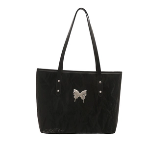 Elegant black glossy tote bag with silver butterfly accent and thin leather straps