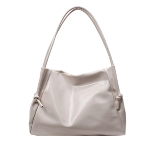 Chic cream white faux leather tote bag with knot strap detail for daily commute