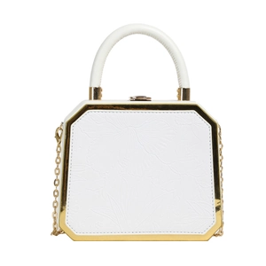 Elegant white octagonal handbag with embossed floral pattern and gold metal frame detailing