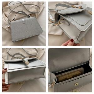 Detail view of silver crossbody bag showing interior capacity and textured metallic finish