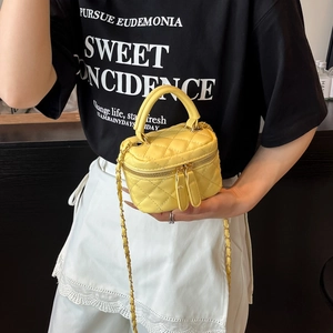 Mini yellow quilted chain bag with gold hardware and top handle for women