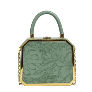 Chic light green octagonal handbag with embossed leaf pattern and gold metal frame